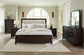 Neymorton King Upholstered Panel Bed with Mirrored Dresser and Chest