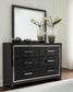 Kaydell King Upholstered Panel Storage Bed with Mirrored Dresser and Chest